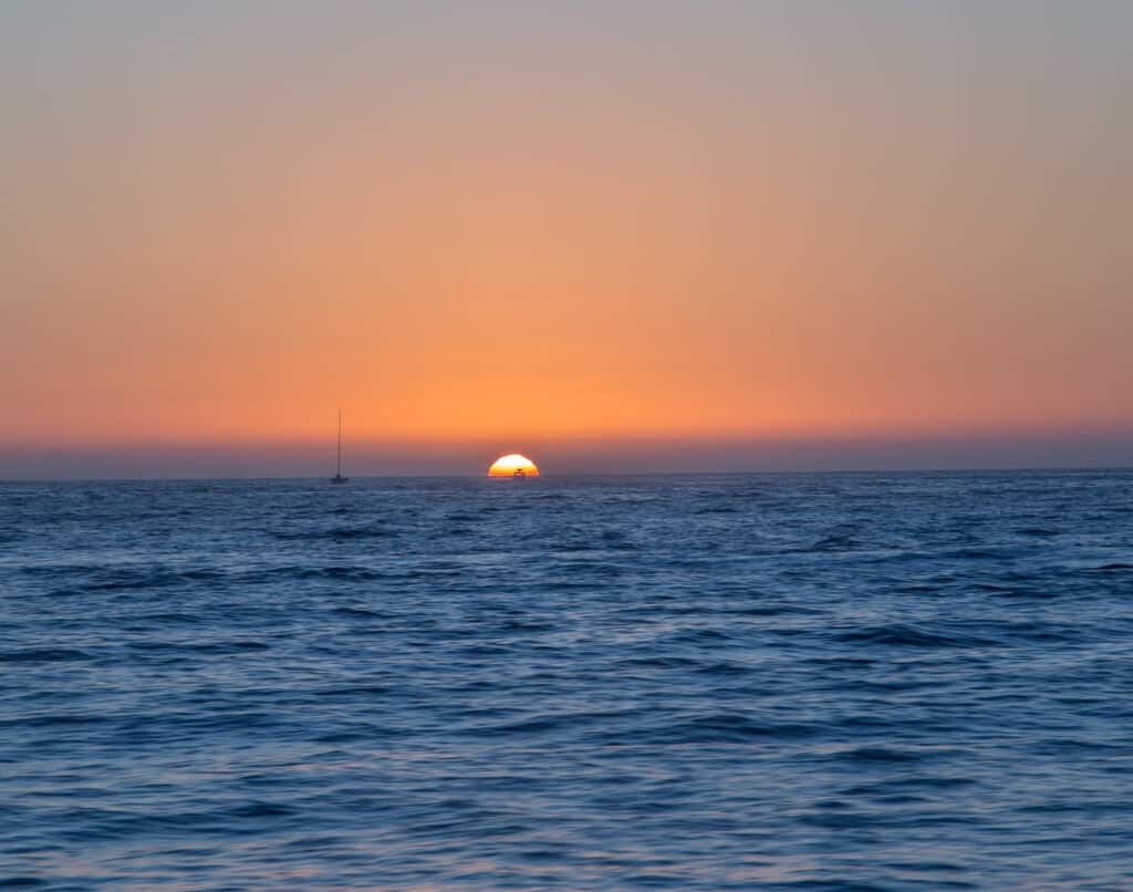 Sun sets over the pacific ocean